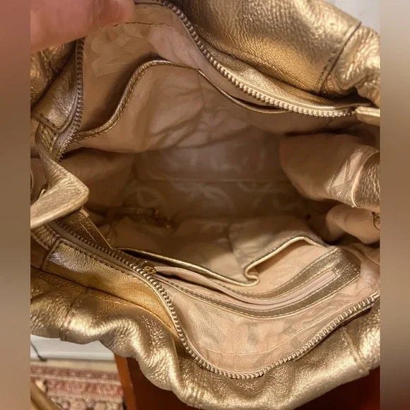 Michael Kors Metallic Gold Leather Drawstring Shoulder Bag. - Picture 13 of 16